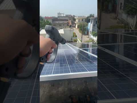 Washing solar panels with high pressure water gun