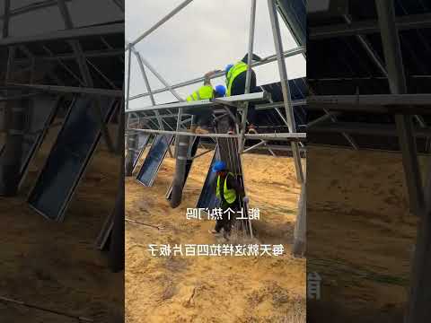 Workers install solar panels