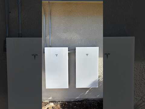 31 all black 420W solar panels with two Tesla Powerwalls ran through the attic across the house