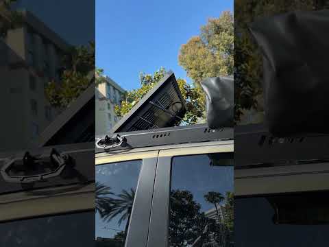 Solar panel with gas struts installed on Toyota Tacoma Trailhunter